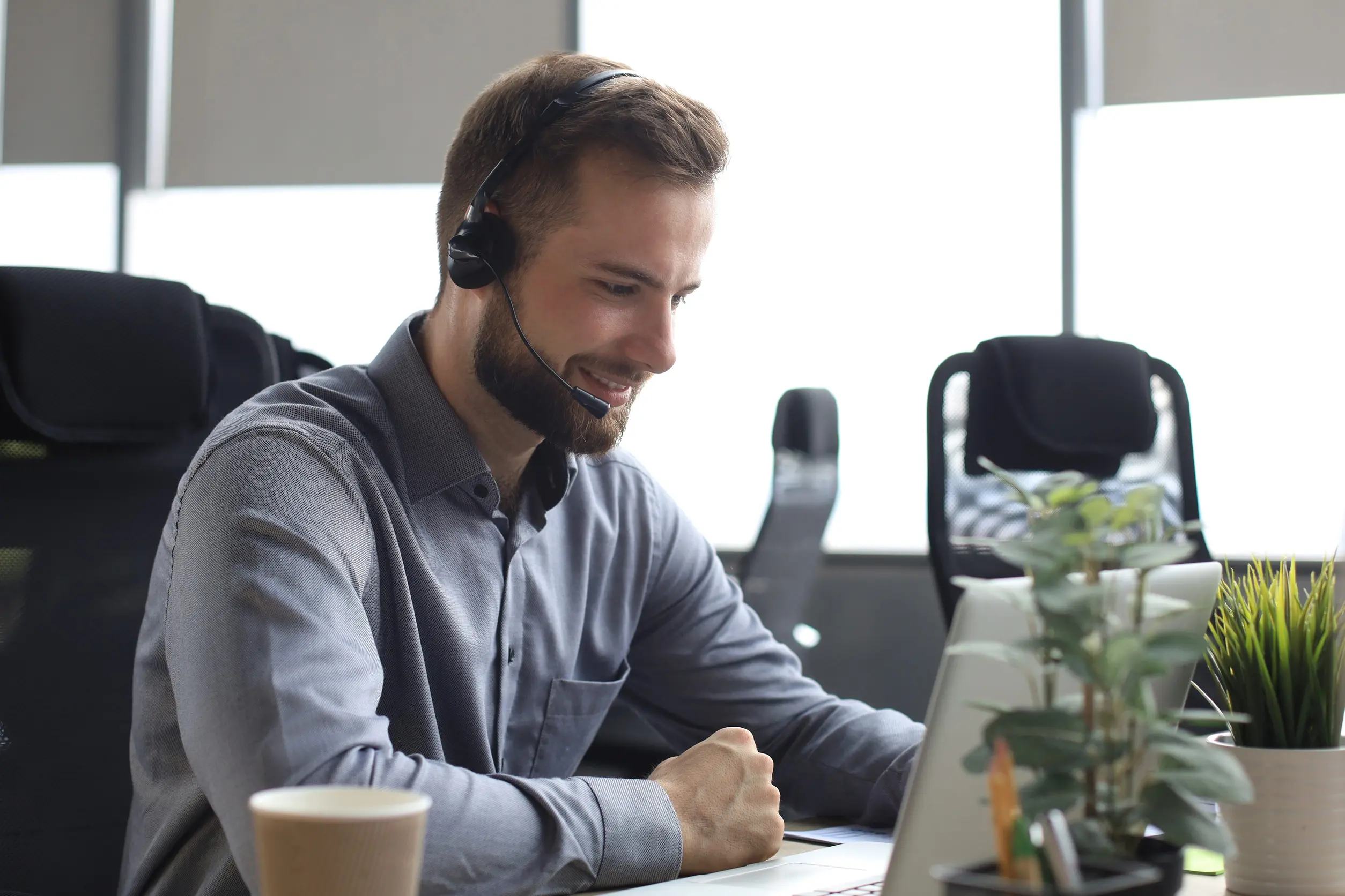 Small business owner using virtual receptionist services